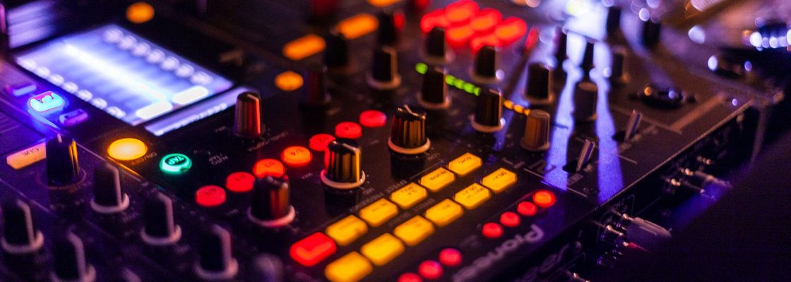 Modern DJ mixer with glowing buttons